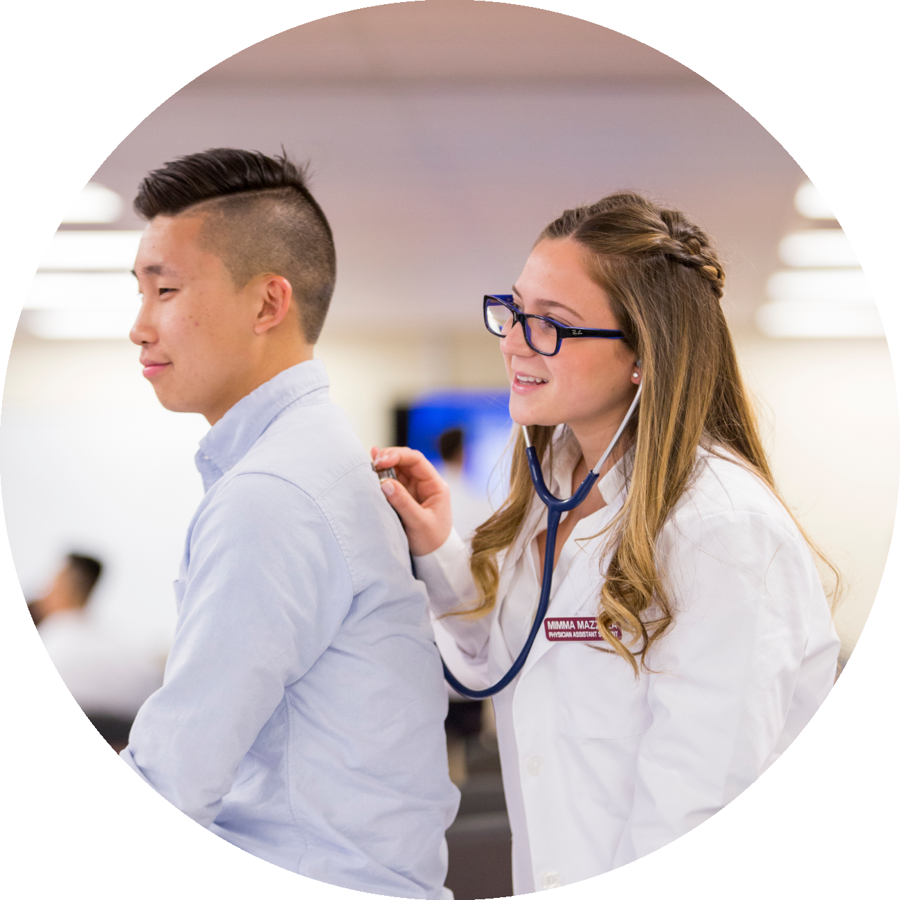students practicing using stethoscope.