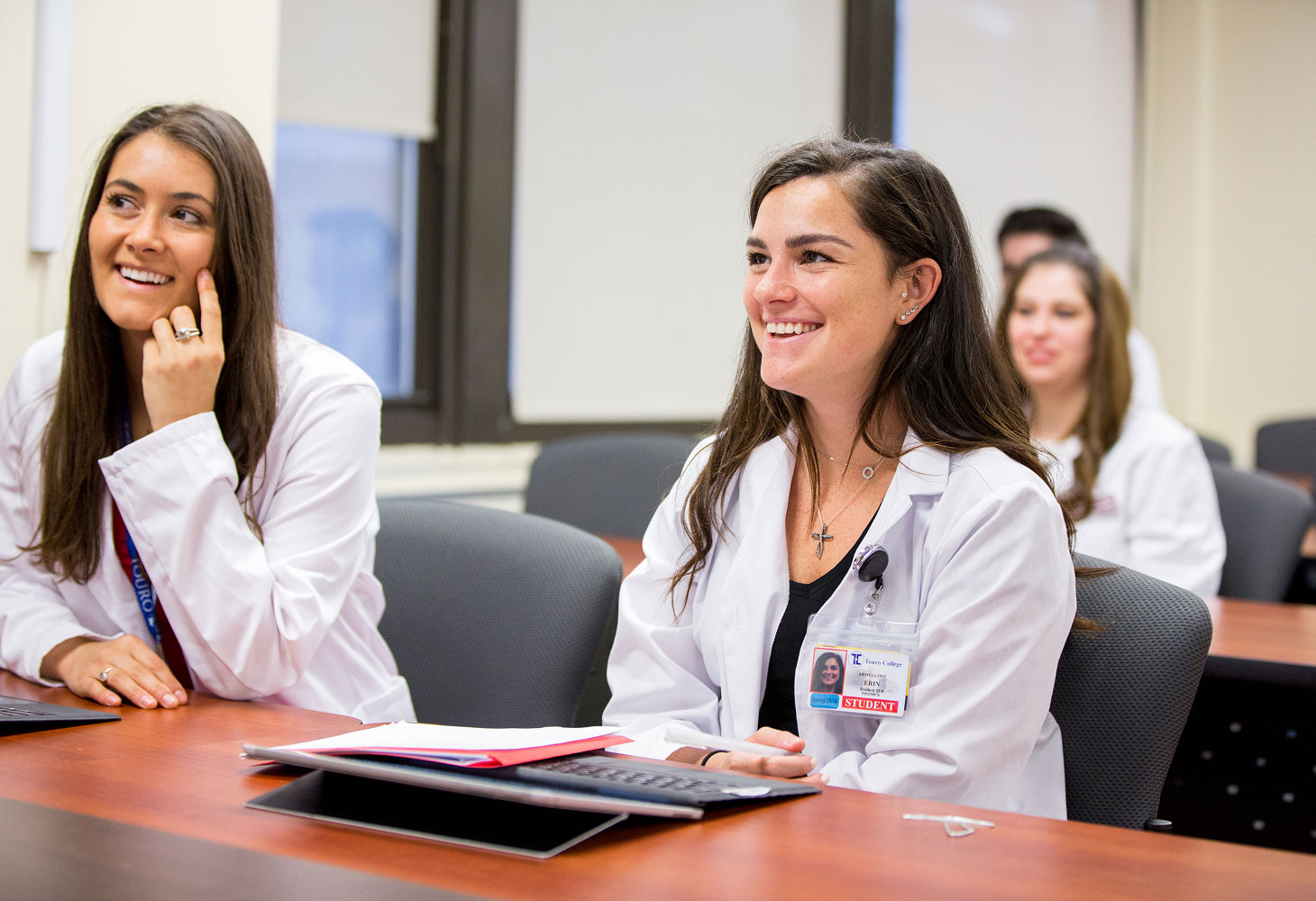 group of students smiling during class.